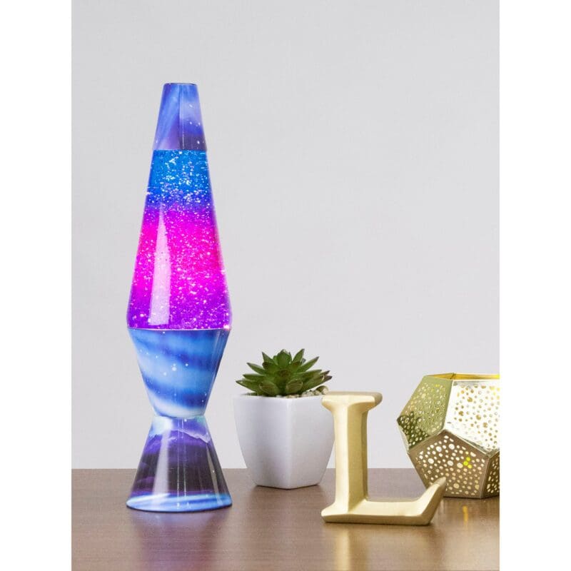 21600401US-LavaLamp-14-5-Colormax-Northern-Lights-Glitter-web 14.5” LAVA® Lamp Colormax Northern Lights – Glitter on a table with a succulent and a candle